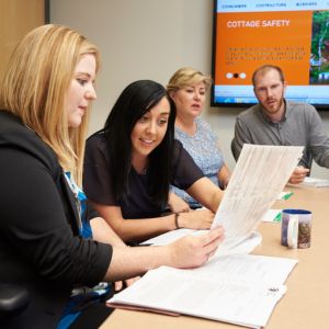 four people working around a table