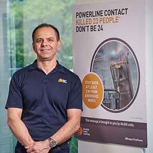 Man in front of poster